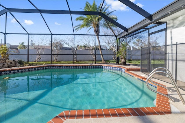 view of pool with glass enclosure, a patio area, fence, and a fenced in pool