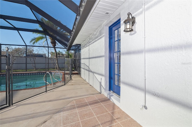 view of swimming pool with a patio area, a fenced in pool, a lanai, and fence