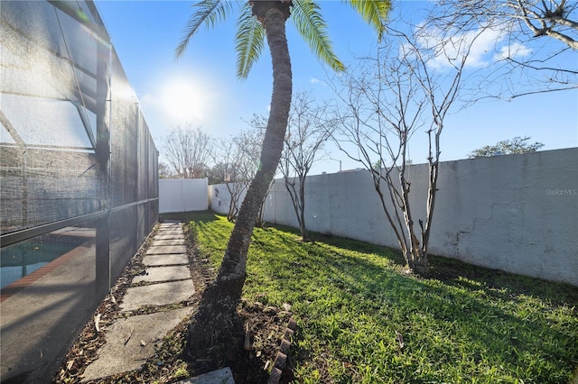 view of yard with a fenced backyard