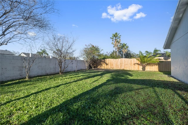 view of yard featuring a fenced backyard