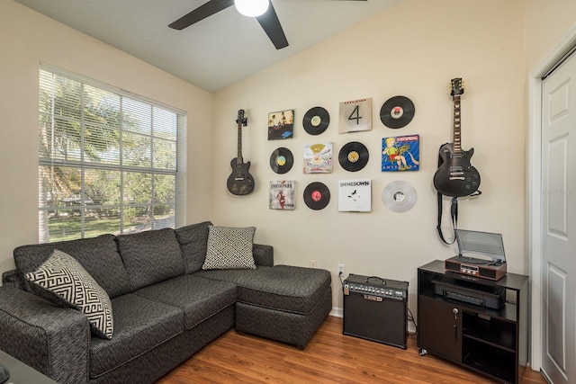 720 Earls Ct, Safety Harbor, FL 34695 - living room with vaulted ceiling, wood finished floors, and a ceiling fan
