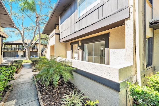 view of home's exterior with stucco siding and board and batten siding