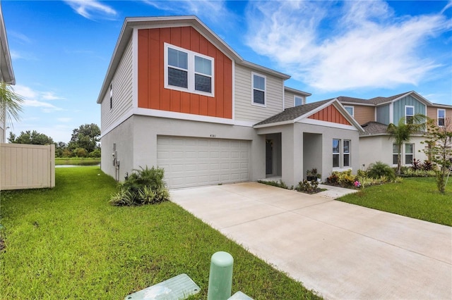 view of front facade with driveway, a front lawn, board and batten siding, and an attached garage