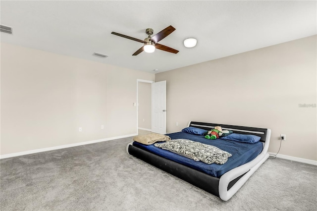 carpeted bedroom featuring a ceiling fan and baseboards