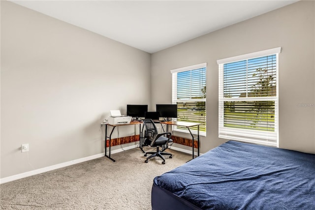 carpeted bedroom with baseboards