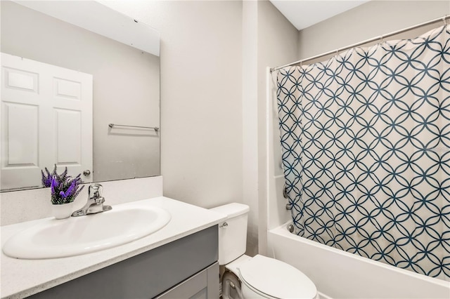 full bathroom featuring toilet, shower / bathtub combination with curtain, and vanity