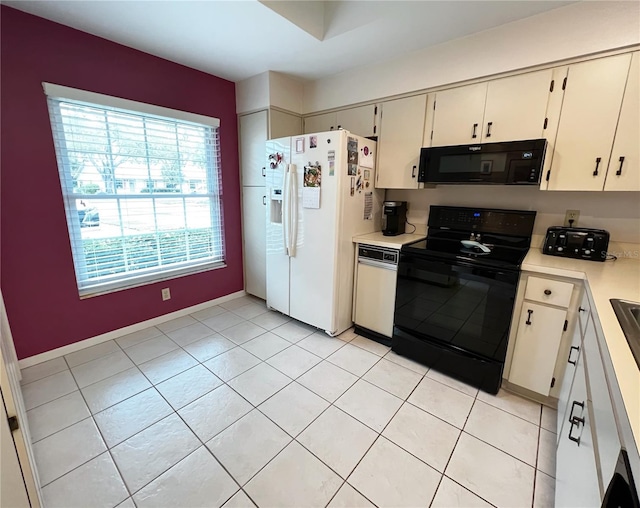 kitchen with light tile patterned floors, black appliances, and light countertops