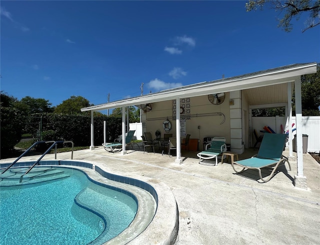 view of swimming pool with a fenced in pool, a patio area, and fence