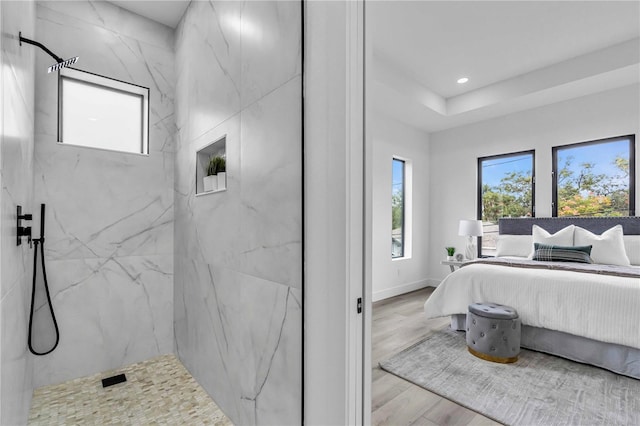 bedroom with recessed lighting, baseboards, multiple windows, and light wood finished floors