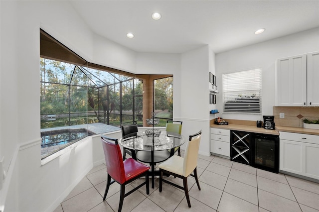 dining area featuring light tile patterned floors and recessed lighting