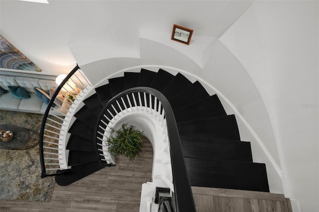 staircase with wood finished floors