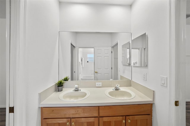 bathroom with double vanity and a sink