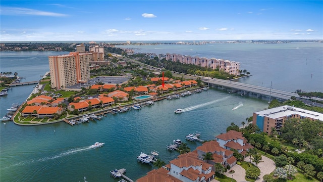 birds eye view of property featuring a view of city and a water view