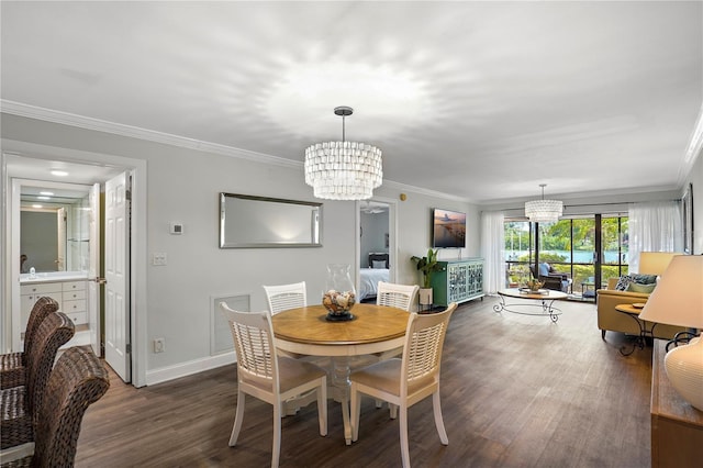 dining space with ornamental molding, dark wood finished floors, and an inviting chandelier