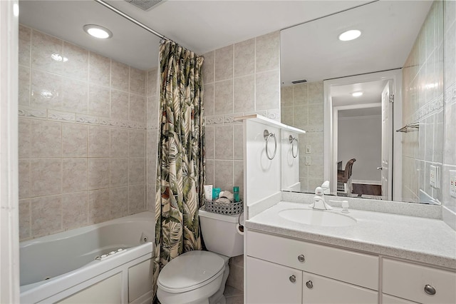 full bathroom featuring shower / tub combo, toilet, vanity, tile walls, and recessed lighting