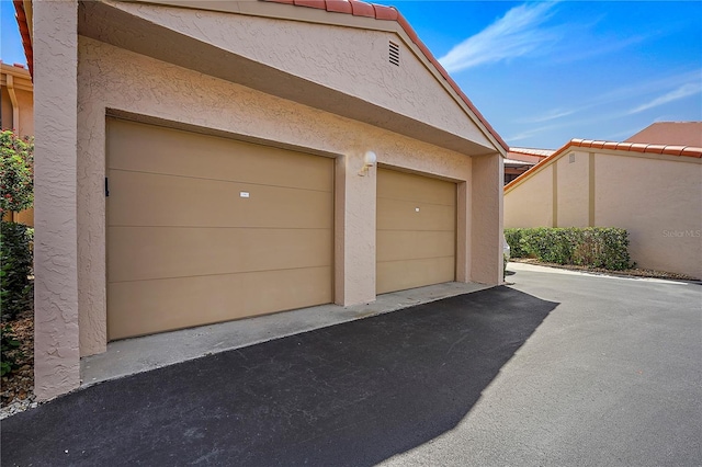 garage with driveway