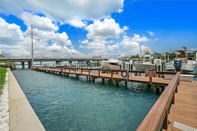 view of dock featuring a water view and boat lift