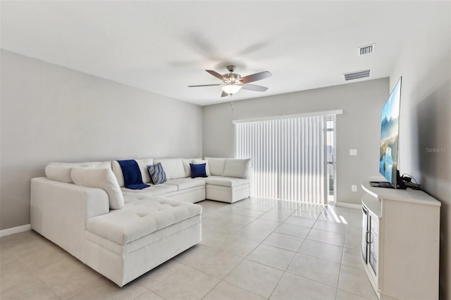 living area with visible vents, light tile patterned flooring, and ceiling fan