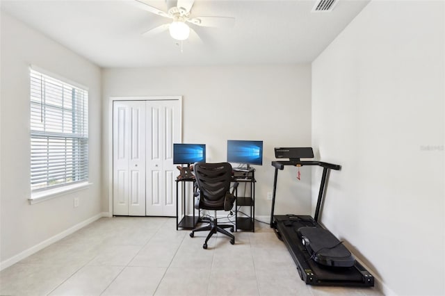 office with light tile patterned floors, baseboards, a ceiling fan, and visible vents