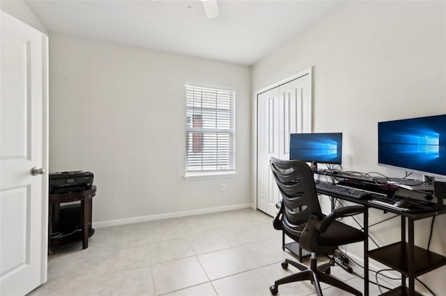 home office featuring tile patterned floors and baseboards