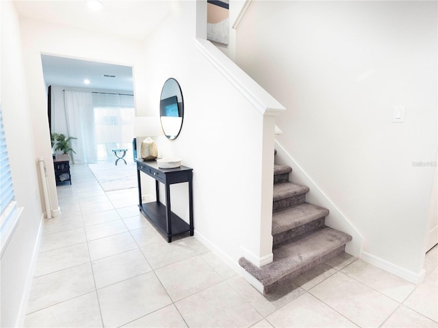 29922 Marquette Ave, Wesley Chapel, FL 33545 - stairway with tile patterned flooring and baseboards