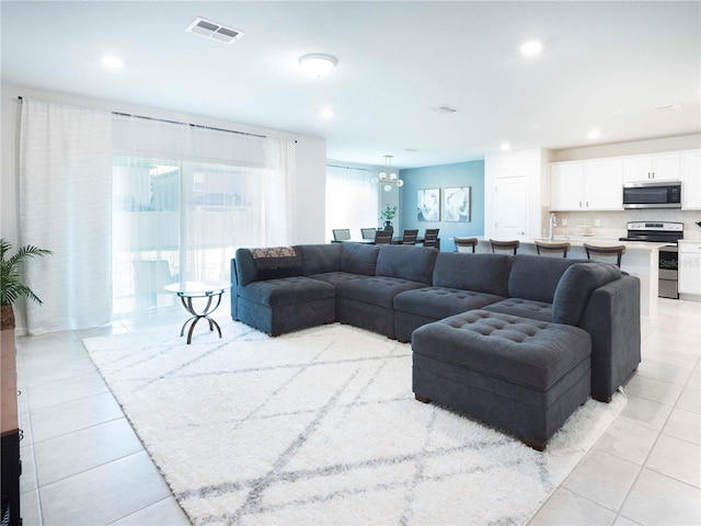 29922 Marquette Ave, Wesley Chapel, FL 33545 - living room with recessed lighting, visible vents, and light tile patterned floors