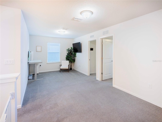 29922 Marquette Ave, Wesley Chapel, FL 33545 - spare room with carpet, visible vents, and baseboards
