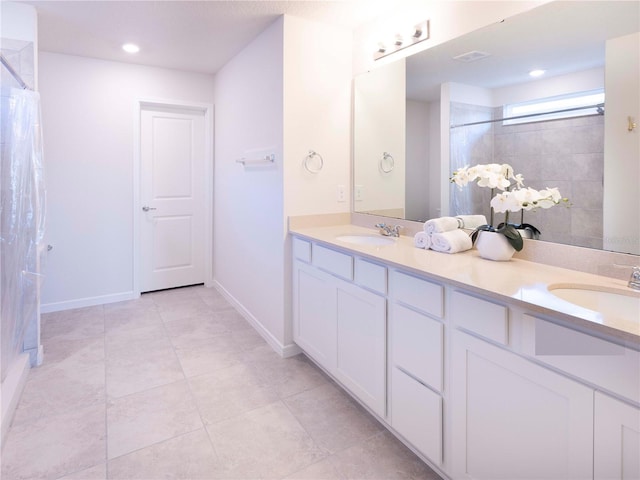29922 Marquette Ave, Wesley Chapel, FL 33545 - full bathroom featuring baseboards, double vanity, a sink, and a shower with curtain