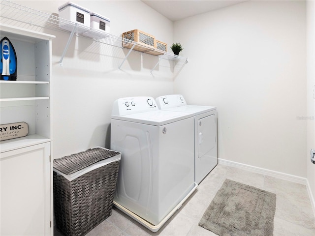 29922 Marquette Ave, Wesley Chapel, FL 33545 - washroom with laundry area, washing machine and dryer, and baseboards