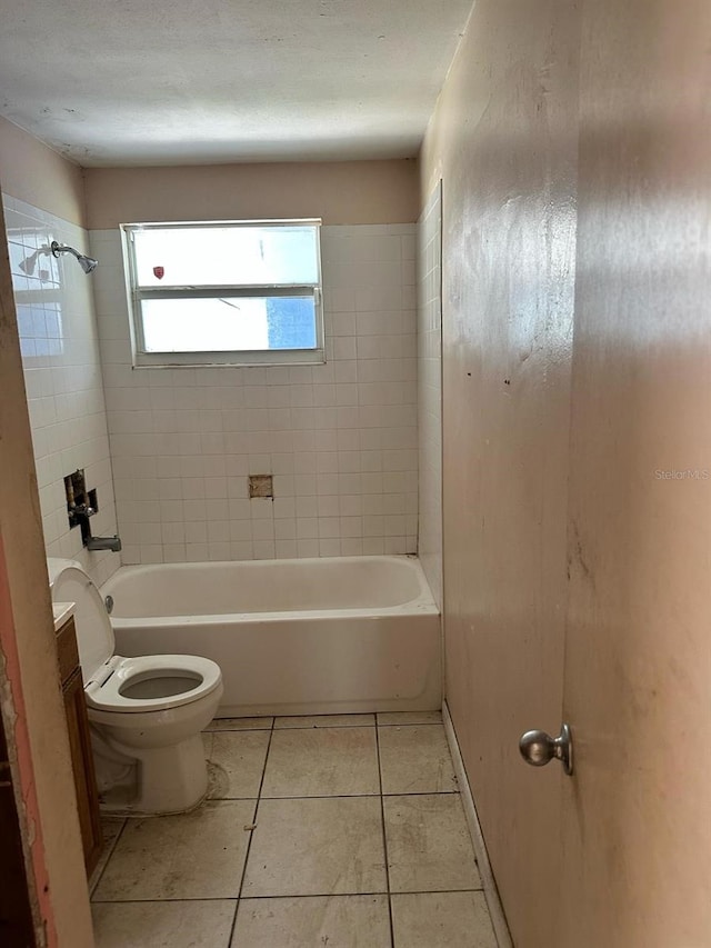 bathroom featuring toilet, tile patterned flooring, bathtub / shower combination, and vanity