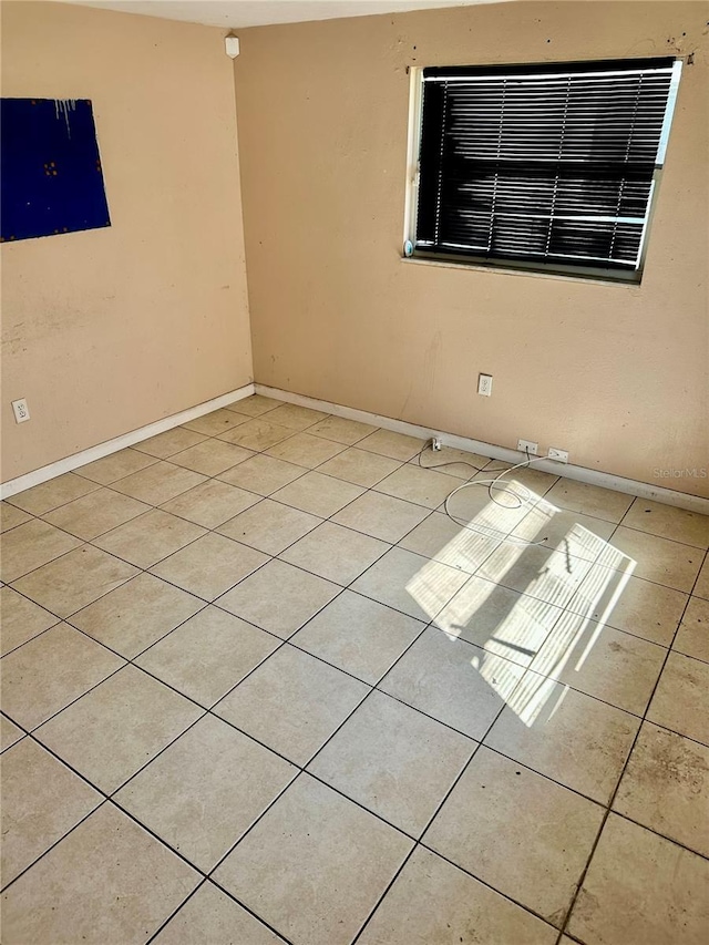 954 Fordson Ave, Labelle, FL 33935 - spare room featuring light tile patterned floors and baseboards
