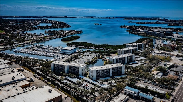 birds eye view of property featuring a city view and a water view