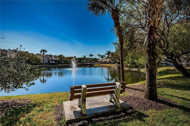 exterior space with a yard and a water view