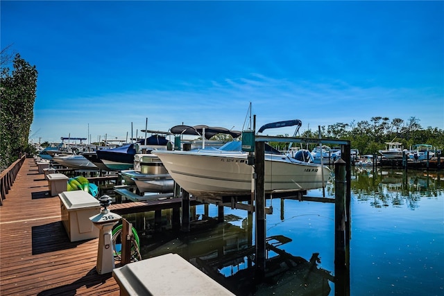 view of dock featuring a water view and boat lift