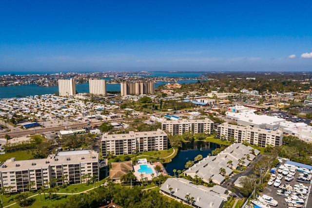 birds eye view of property featuring a water view and a view of city