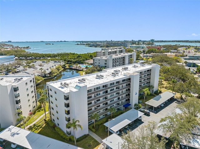 birds eye view of property featuring a view of city and a water view