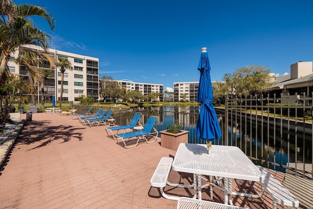 view of patio / terrace featuring outdoor dining area and a water view