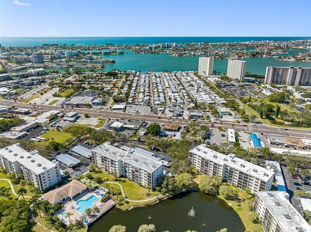 drone / aerial view featuring a view of city and a water view