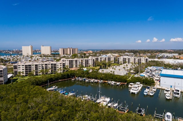 drone / aerial view featuring a view of city and a water view