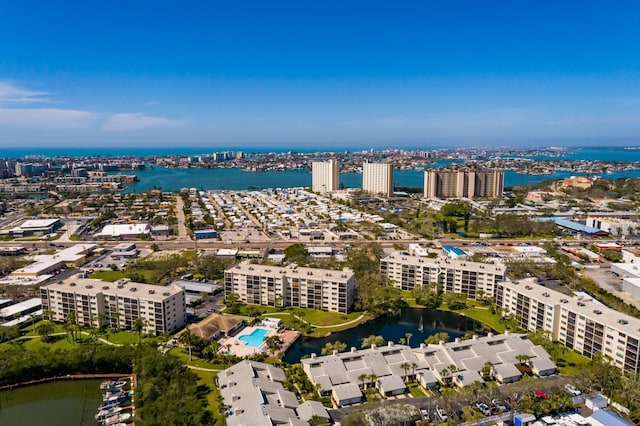 drone / aerial view featuring a water view and a view of city