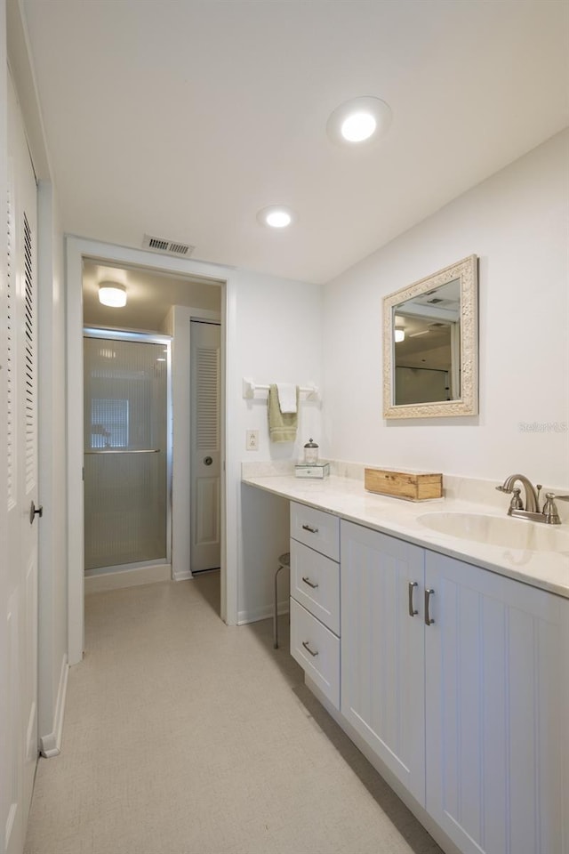 full bath featuring visible vents, a shower stall, recessed lighting, a closet, and vanity