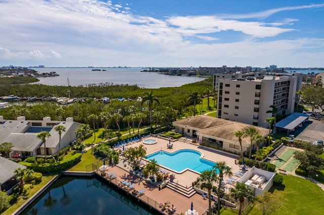 birds eye view of property with a water view