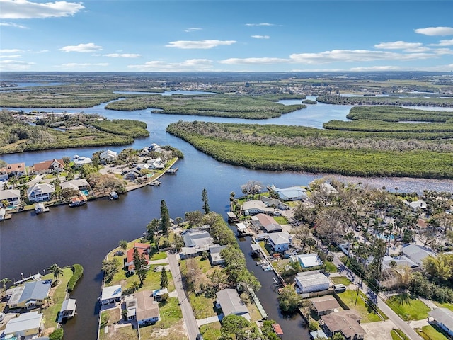 drone / aerial view with a water view and a residential view