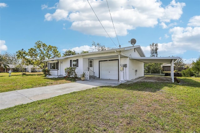 ranch-style house featuring an attached carport, concrete driveway, an attached garage, and a front lawn