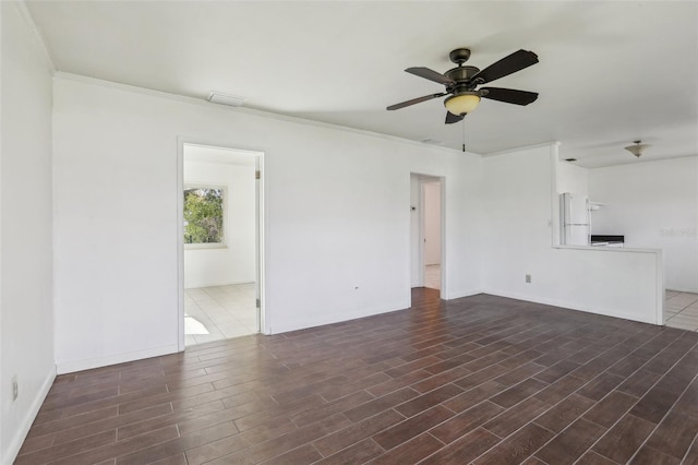 unfurnished living room with crown molding, ceiling fan, and wood finished floors