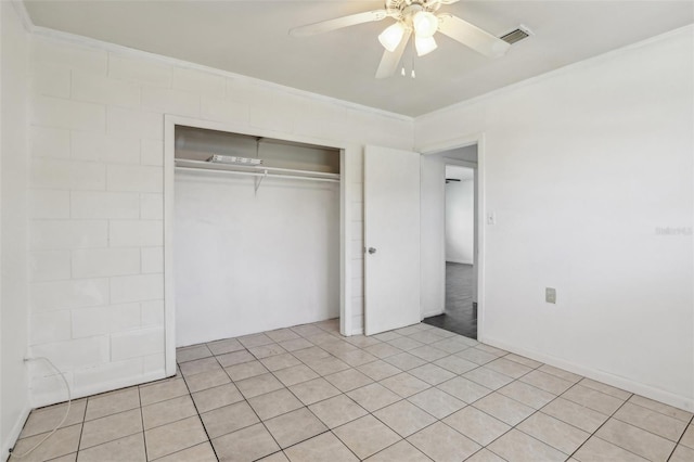 unfurnished bedroom with ceiling fan, a closet, visible vents, and crown molding