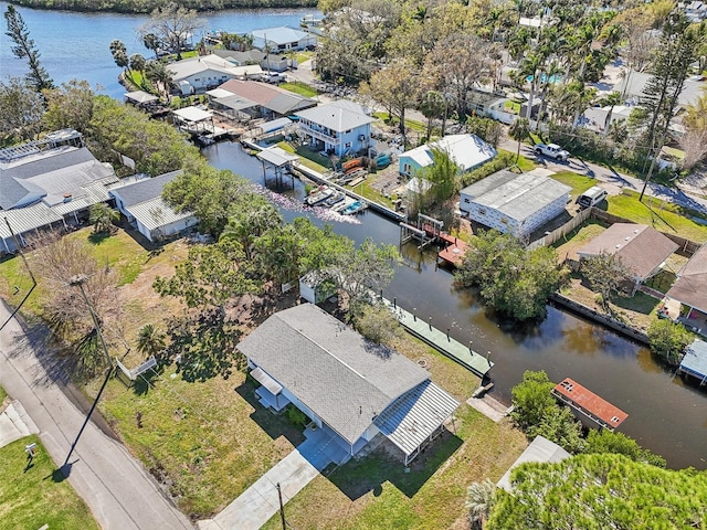 bird's eye view featuring a residential view and a water view