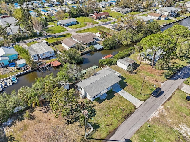 aerial view with a residential view and a water view