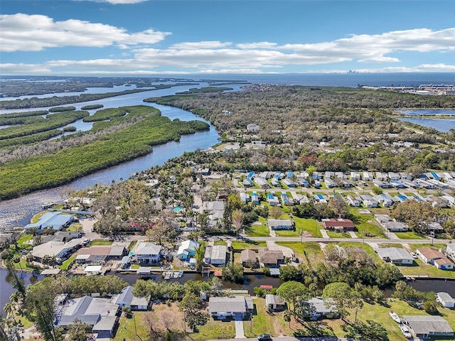 drone / aerial view featuring a residential view and a water view