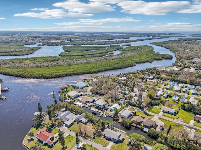 birds eye view of property with a water view and a residential view